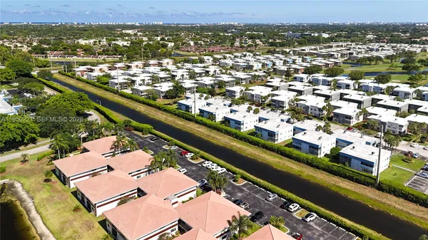 an aerial view of residential houses with city view