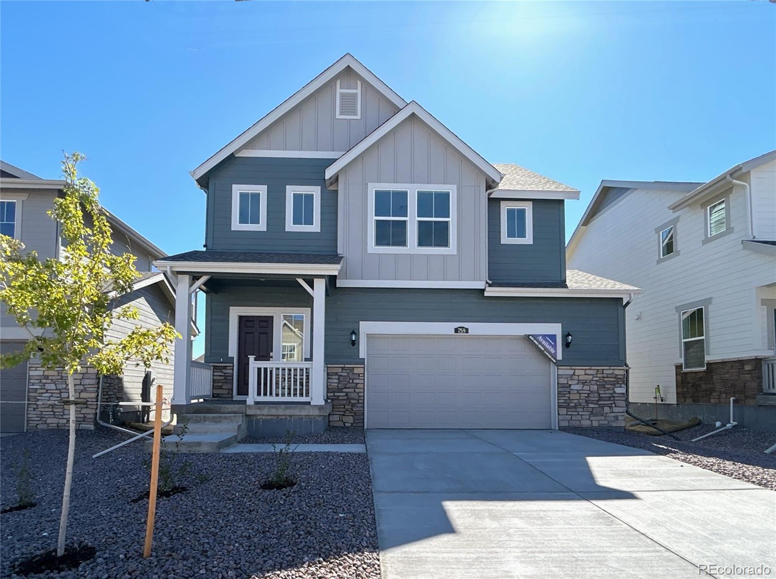 a front view of a house with garage