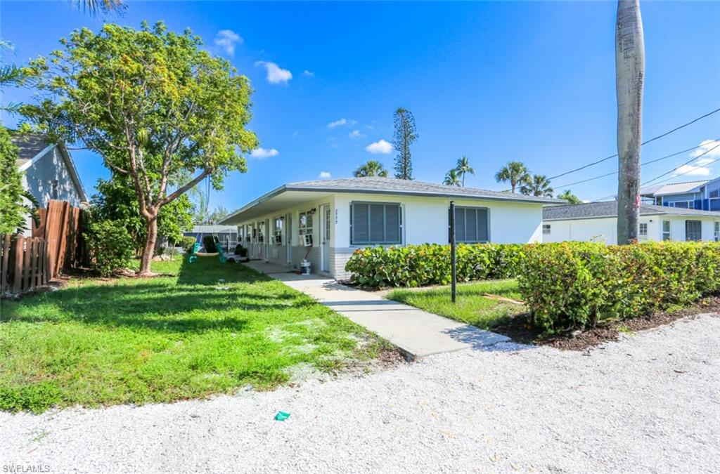 2777 Shoreview Drive, Unit 2 Naples, FL 34112 - Photo 1 of 8 Single story home with a front lawn