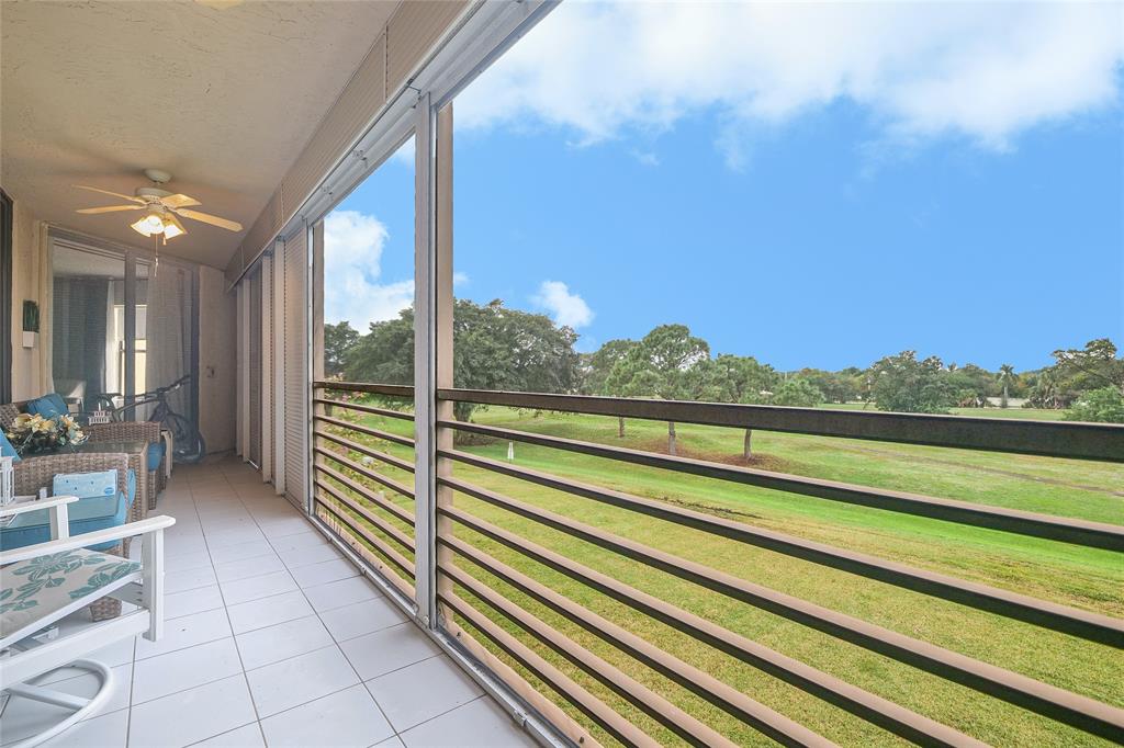 a view of balcony with furniture