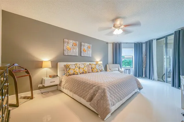 a view of swimming pool with a chairs