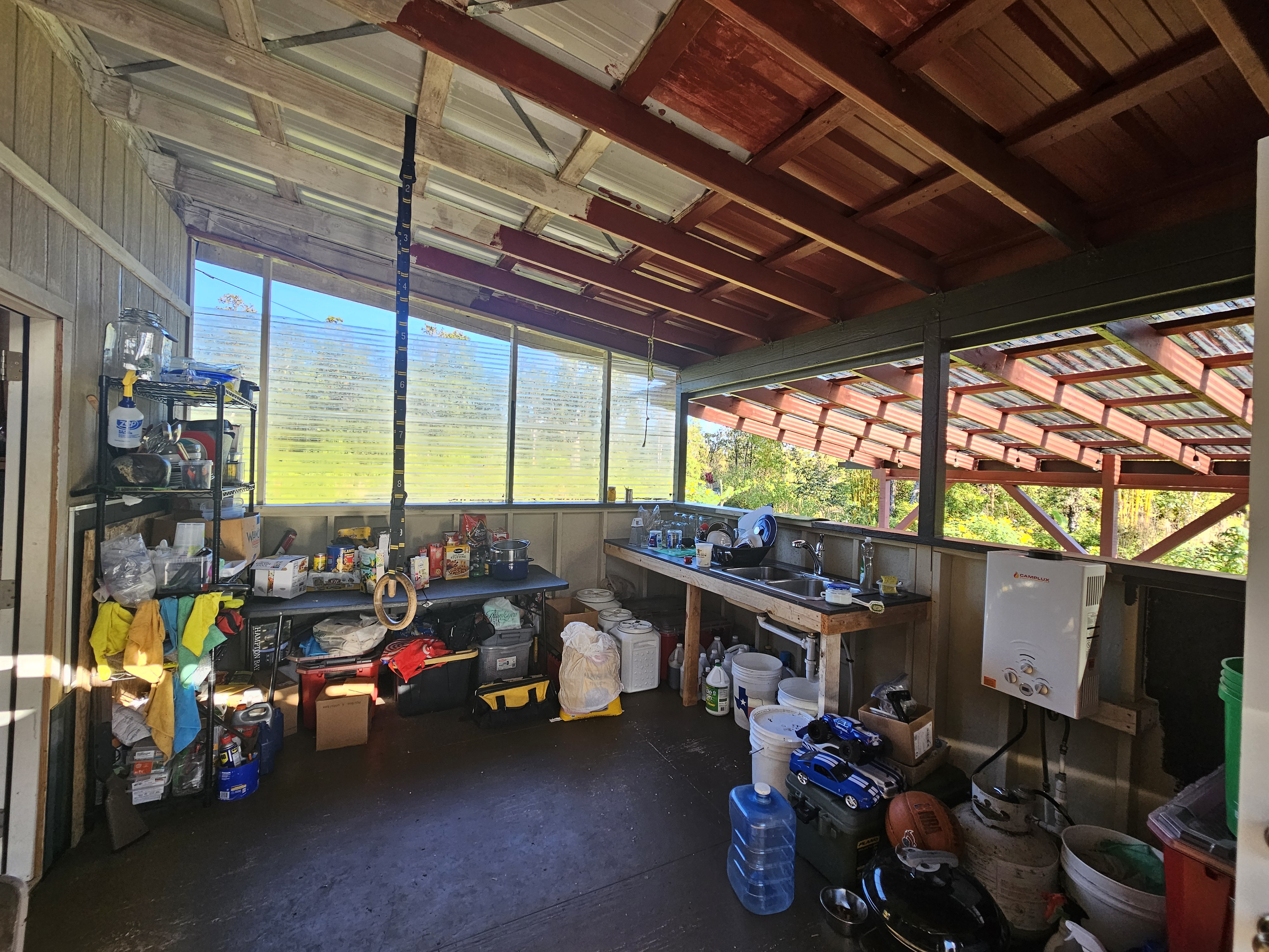 11-2093 Alii Wao Road Pahoa, HI 96778 - Photo 12 of 21 a view of a garage with a table and chairs