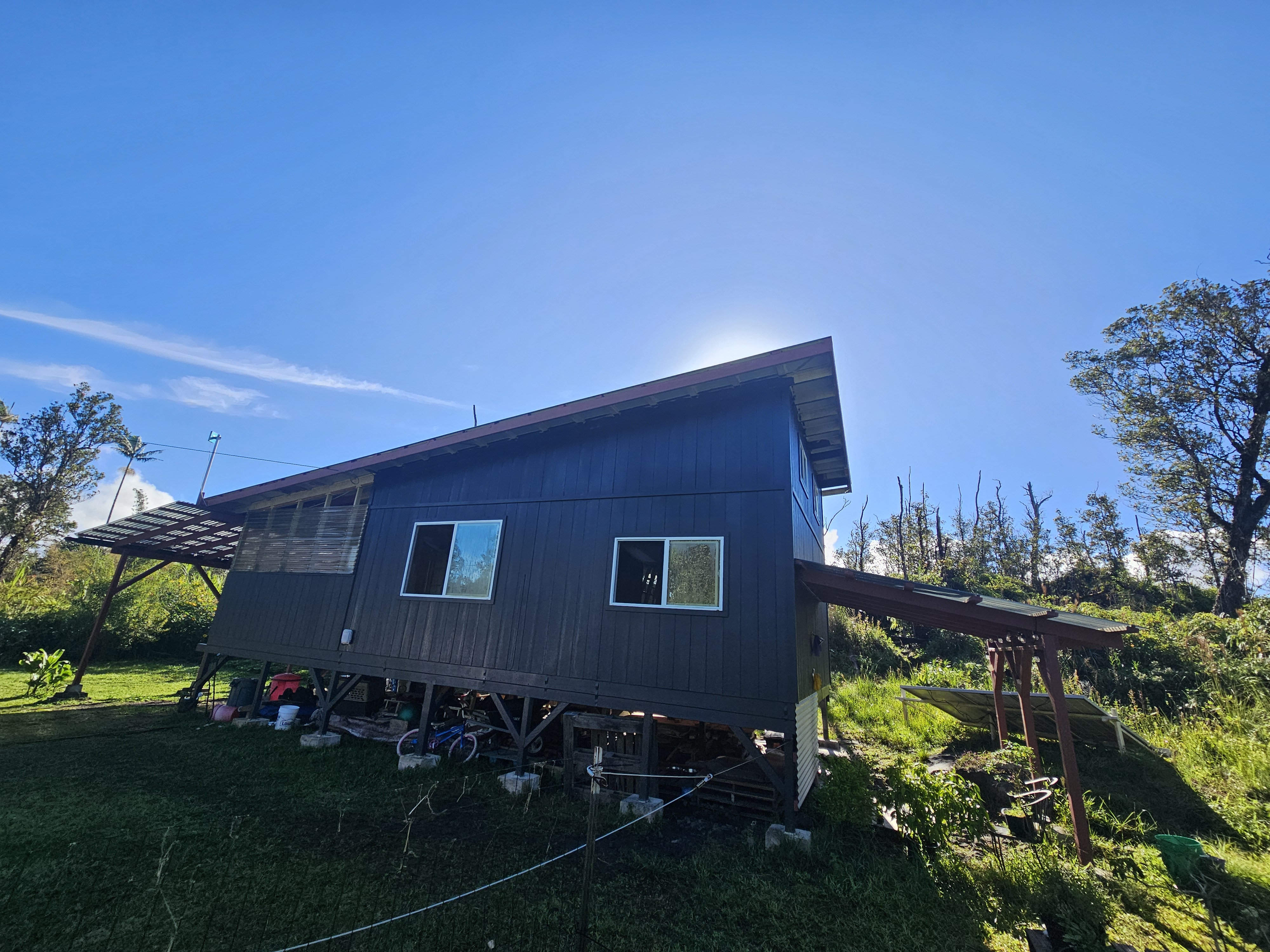 11-2093 Alii Wao Road Pahoa, HI 96778 - Photo 5 of 21 a front view of a house with a yard