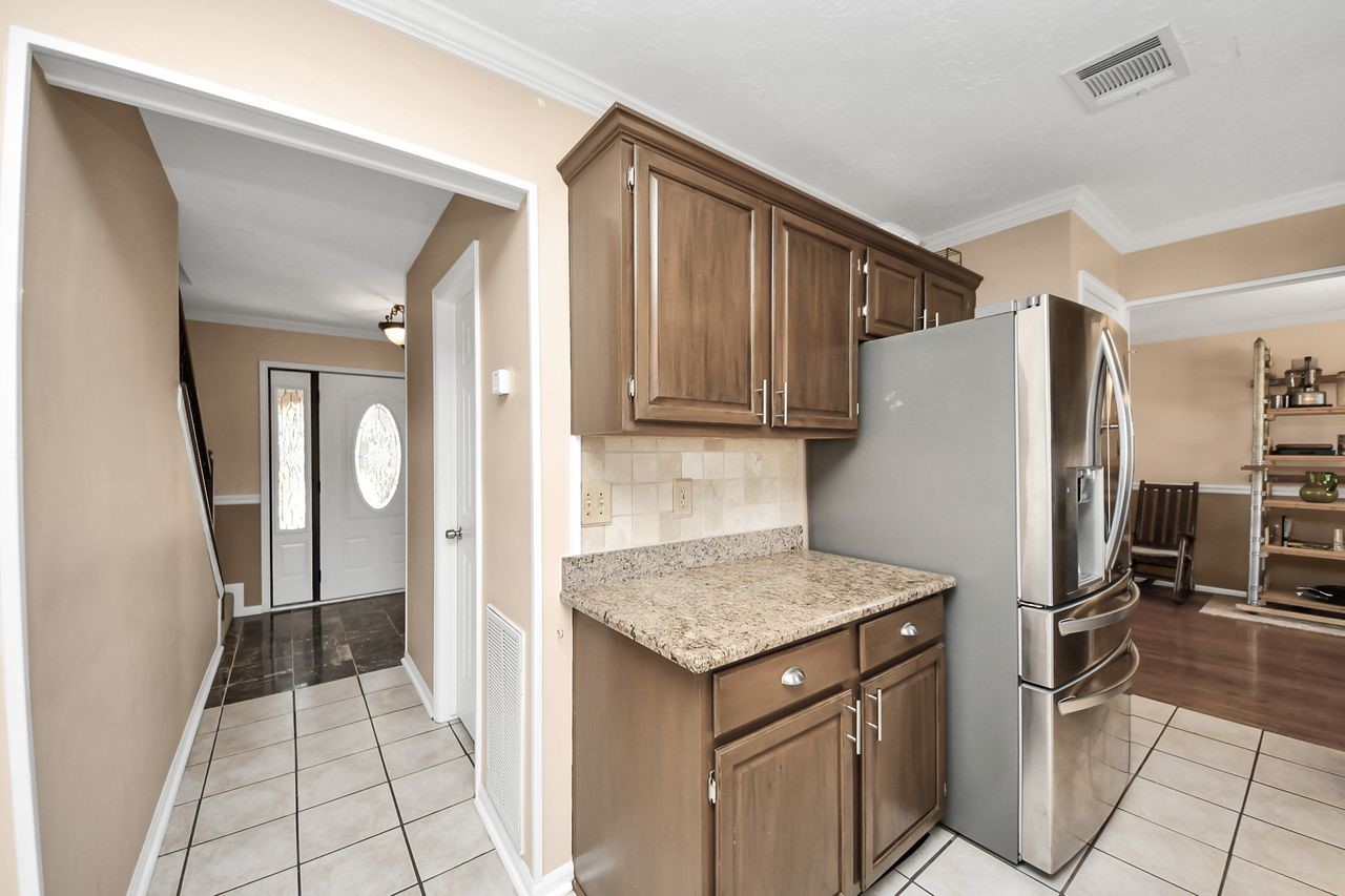 7607 Plum Tree Forest Circle Houston, TX 77095 - Photo 14 of 42 a kitchen with a refrigerator and a sink