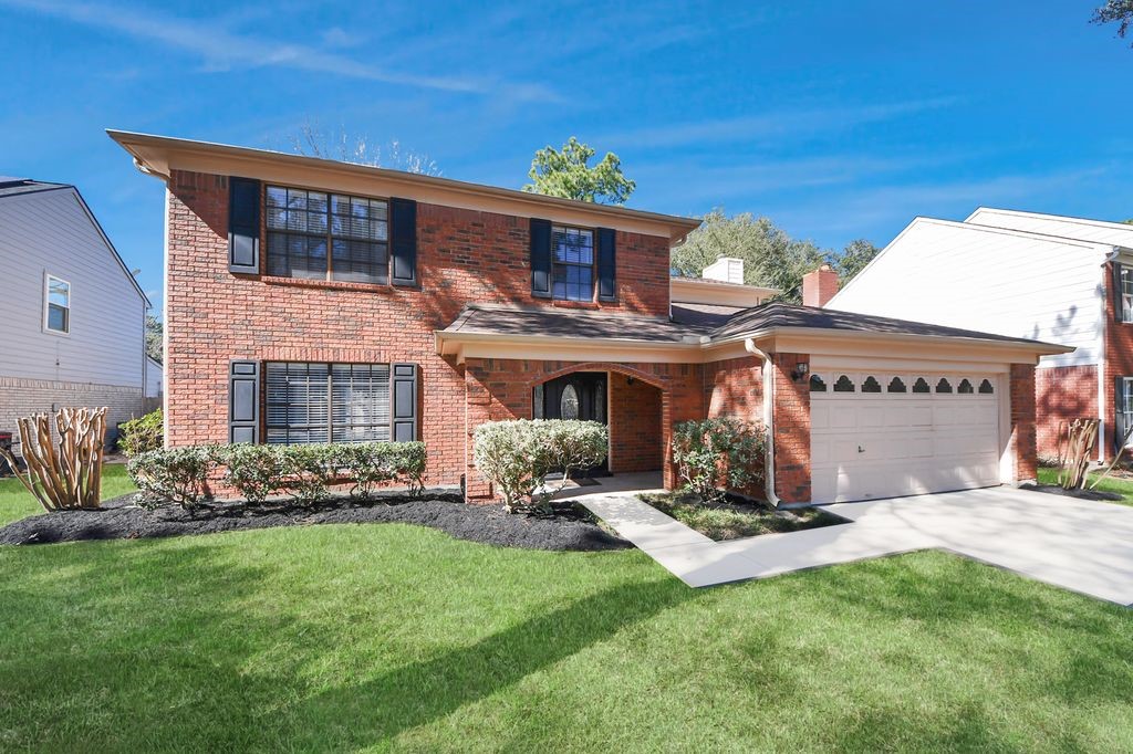 7607 Plum Tree Forest Circle Houston, TX 77095 - Photo 2 of 42 a view of a house with a yard