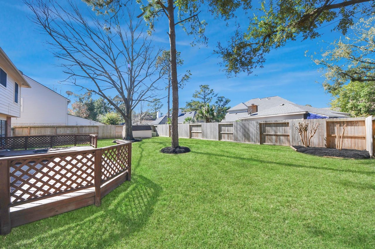 7607 Plum Tree Forest Circle Houston, TX 77095 - Photo 40 of 42 a view of a deck and a yard