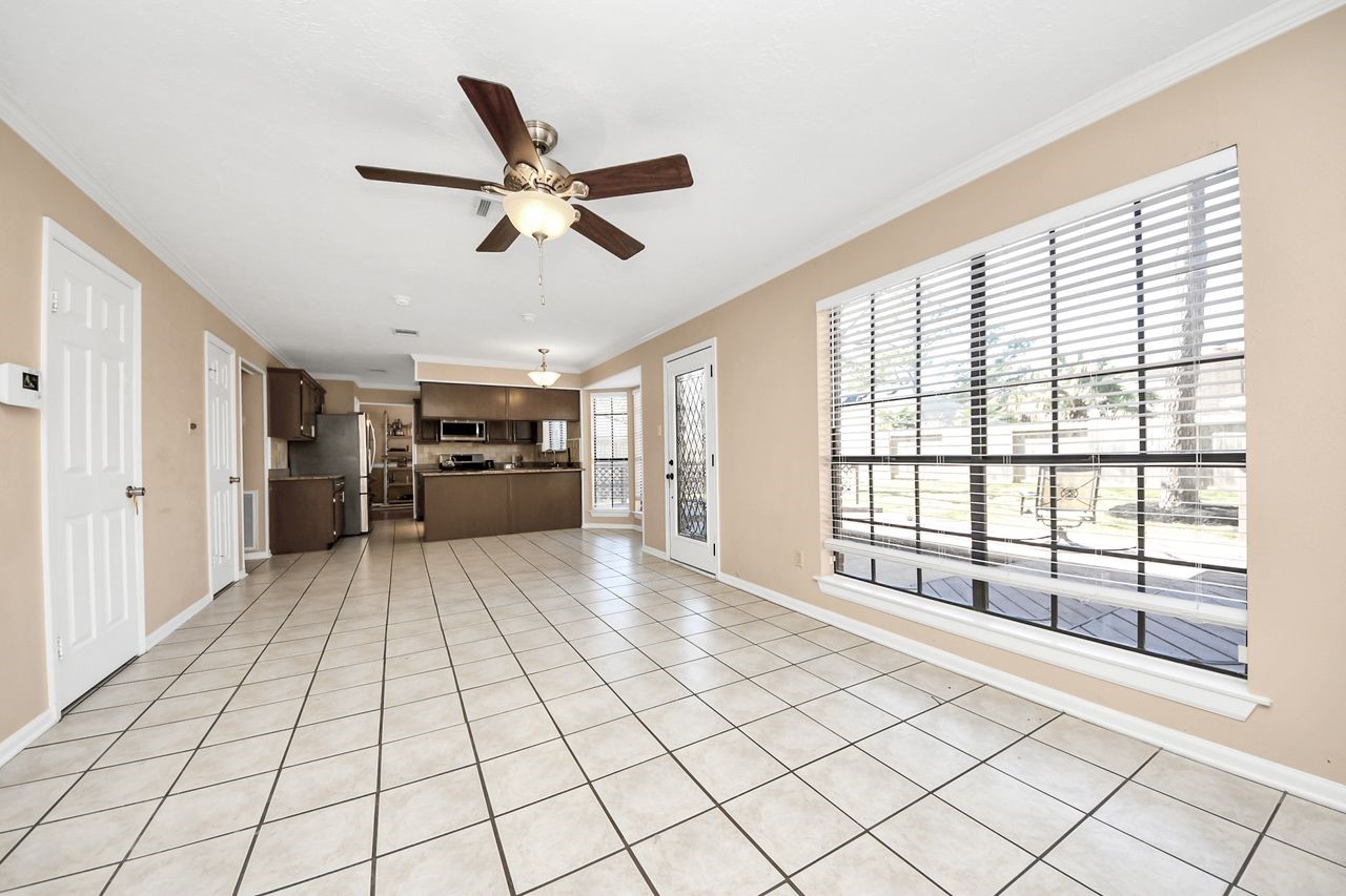 7607 Plum Tree Forest Circle Houston, TX 77095 - Photo 6 of 42 a view of empty room with wooden floor and window