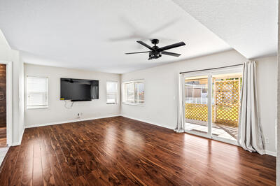 10056 Country Brook Road Boca Raton, FL 33428 - Photo 15 of 15 an empty room with wooden floor and windows