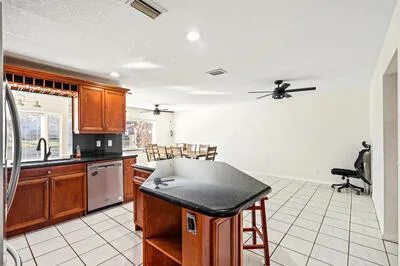 a kitchen with a sink appliances and cabinets