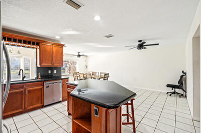 10056 Country Brook Road Boca Raton, FL 33428 - Photo 6 of 15 a kitchen with a sink appliances and cabinets
