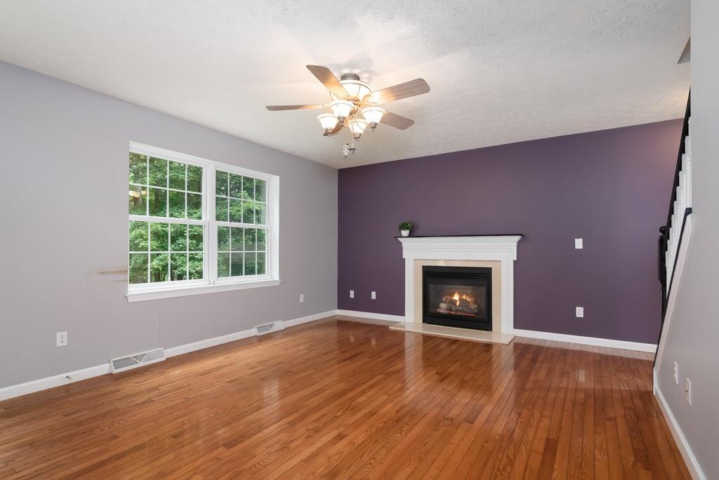 2389 Jenkinson Drive Pittsburgh, PA 15237 - Photo 13 of 29 a view of an empty room with window fireplace and wooden floor