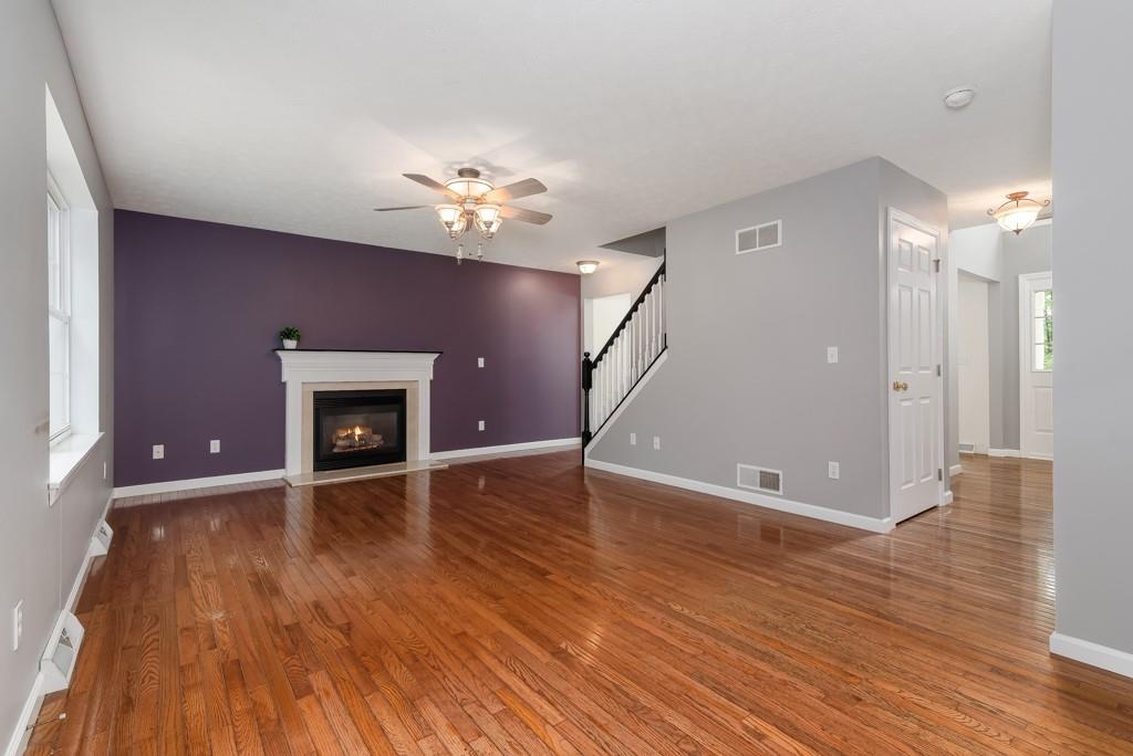 2389 Jenkinson Drive Pittsburgh, PA 15237 - Photo 14 of 29 a view of an empty room with wooden floor and a fireplace