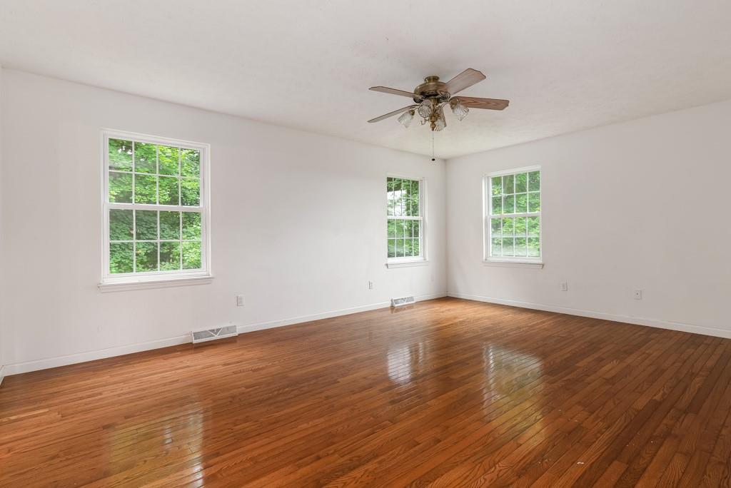 2389 Jenkinson Drive Pittsburgh, PA 15237 - Photo 18 of 29 a view of an empty room with wooden floor and a window