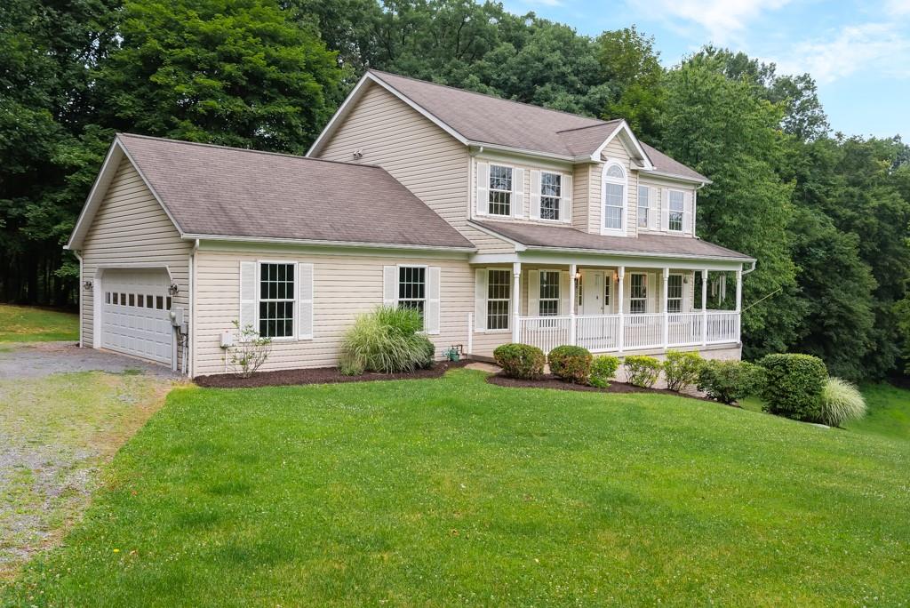 2389 Jenkinson Drive Pittsburgh, PA 15237 - Photo 2 of 29 a view of a house with a yard and plants