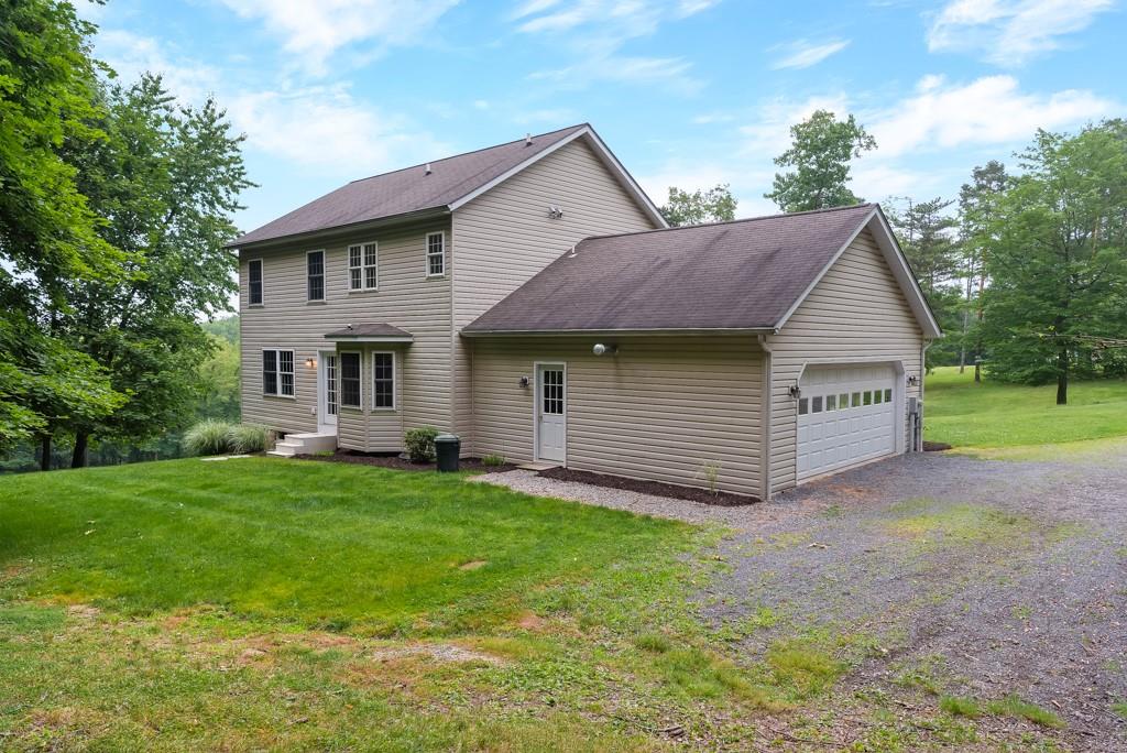 2389 Jenkinson Drive Pittsburgh, PA 15237 - Photo 26 of 29 a view of a house with a yard and large tree