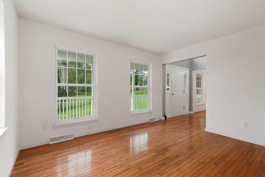 2389 Jenkinson Drive Pittsburgh, PA 15237 - Photo 5 of 29 an empty room with wooden floor and windows