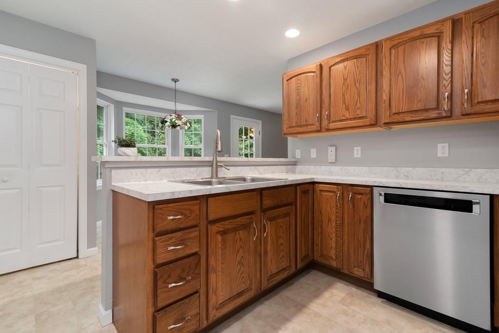 2389 Jenkinson Drive Pittsburgh, PA 15237 - Photo 9 of 29 a kitchen with stainless steel appliances granite countertop wooden cabinets a sink and dishwasher