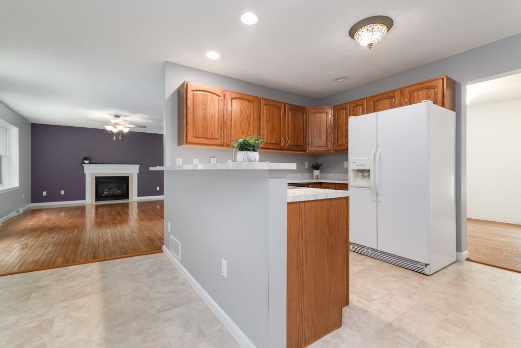 2389 Jenkinson Drive Pittsburgh, PA 15237 - Photo 10 of 29 a kitchen with kitchen island a refrigerator a stove a sink and a counter space