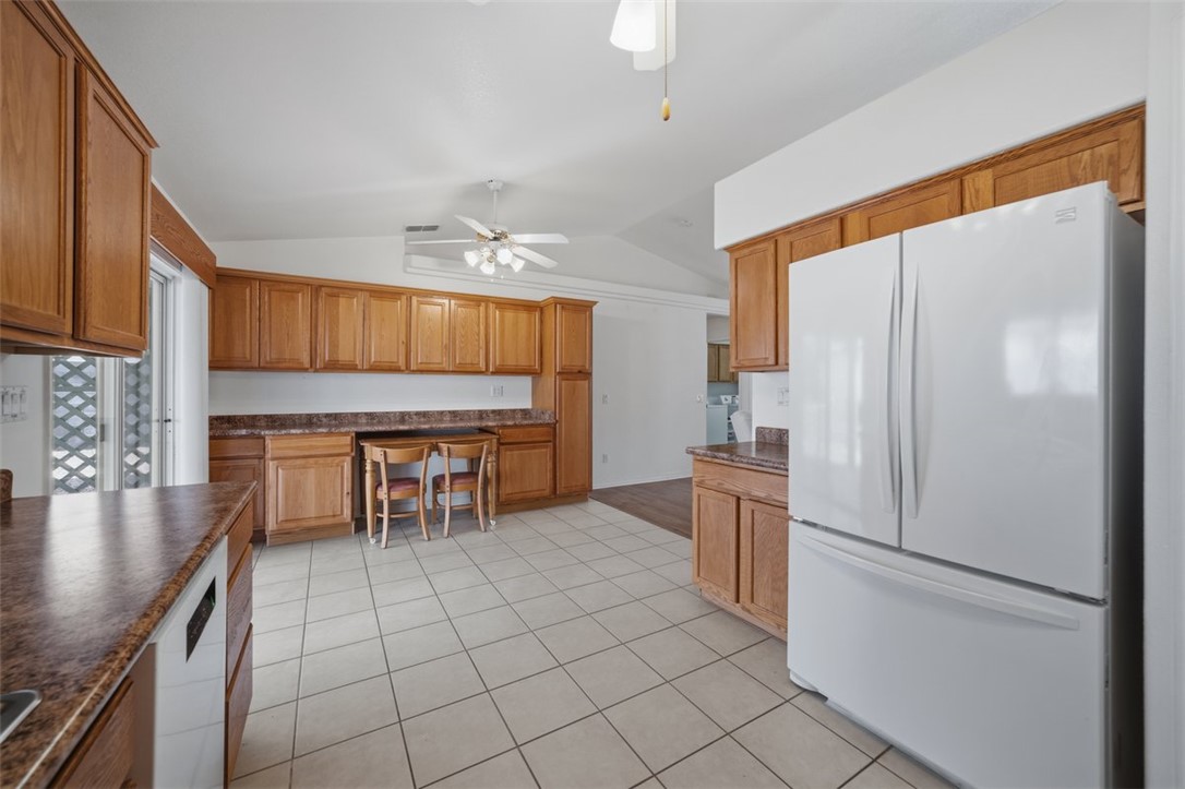 2144 Ridgeview Road Kingman, AZ 86401 - Photo 20 of 49 a kitchen with stainless steel appliances granite countertop a refrigerator and a stove top oven