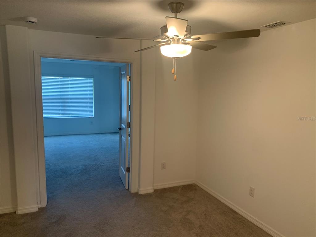 6930 Ripple Pond Loop Zephyrhills, FL 33541 - Photo 17 of 29 an empty room with a bathroom