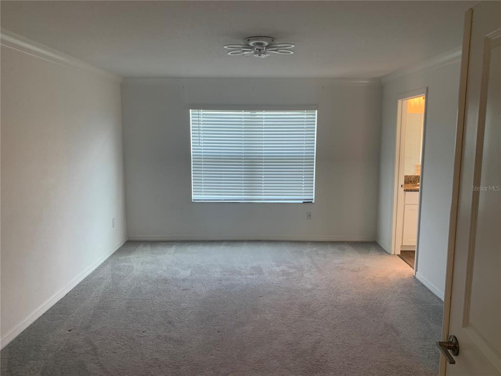 6930 Ripple Pond Loop Zephyrhills, FL 33541 - Photo 18 of 29 an empty room with a window