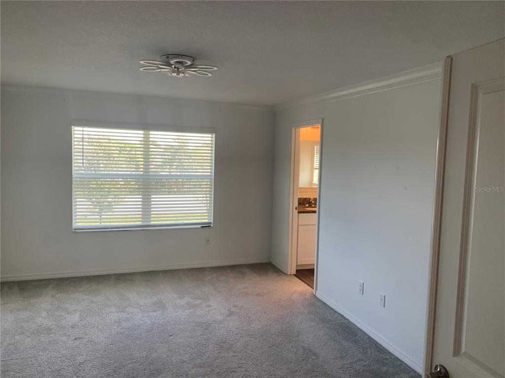 6930 Ripple Pond Loop Zephyrhills, FL 33541 - Photo 19 of 29 a view of an empty room with a window