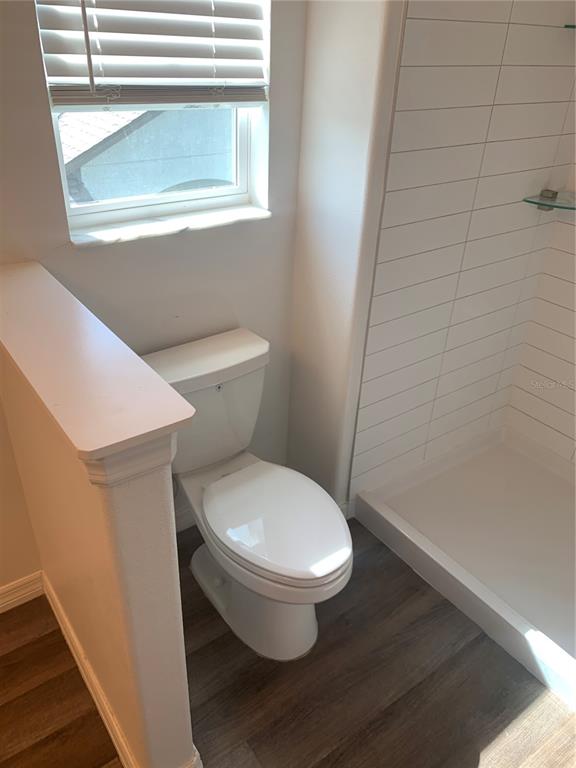 6930 Ripple Pond Loop Zephyrhills, FL 33541 - Photo 23 of 29 a white toilet sitting next to a bathroom sink