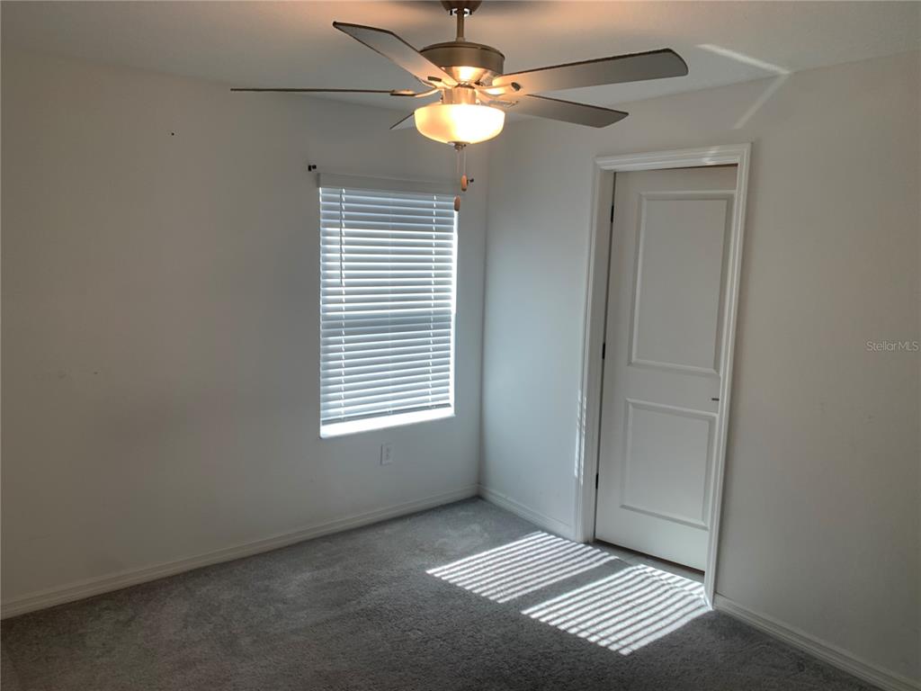 6930 Ripple Pond Loop Zephyrhills, FL 33541 - Photo 28 of 29 a view of an empty room with a window