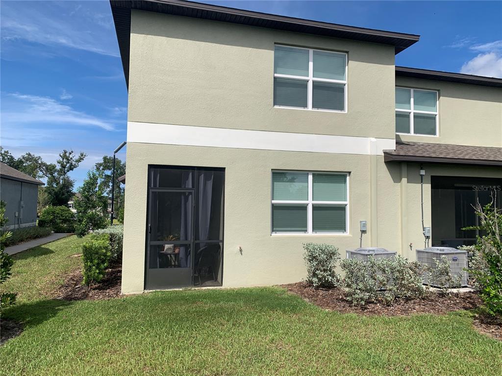 6930 Ripple Pond Loop Zephyrhills, FL 33541 - Photo 6 of 29 a front view of a house with a yard