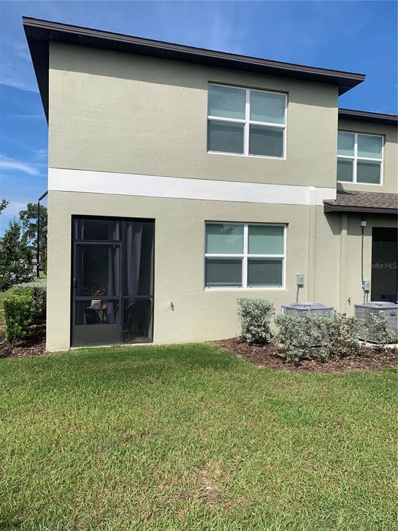 6930 Ripple Pond Loop Zephyrhills, FL 33541 - Photo 7 of 29 a view of a house with garden