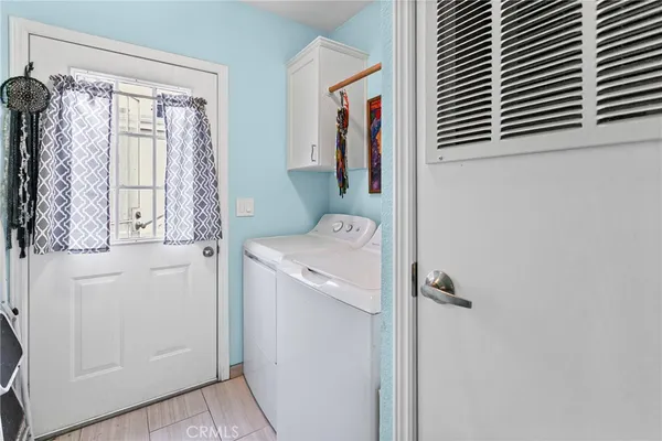 a utility room with a window dryer and washer