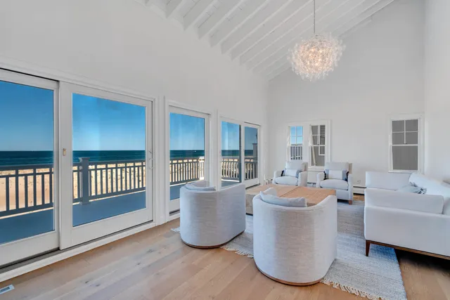 a bedroom with a bed and a lamp on dresser