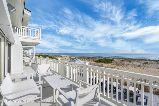 a view of staircase with white walls and a window