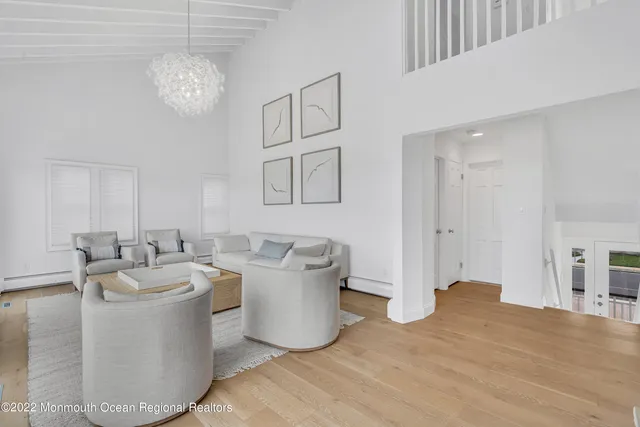 a bedroom with two beds and window