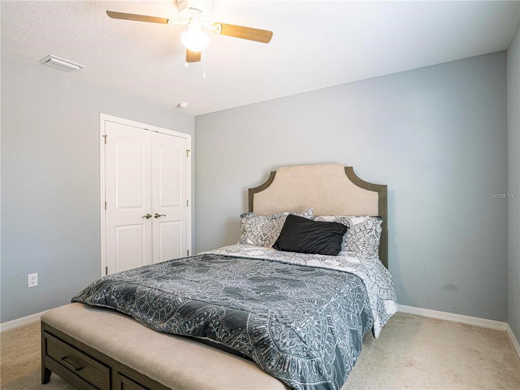 10688 Southwest 129th Terrace Road Dunnellon, FL 34432 - Photo 29 of 35 a bedroom with a bed and closet
