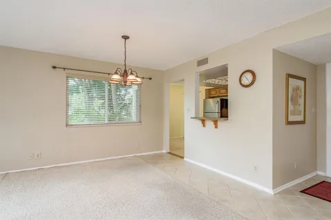 a view of a livingroom with furniture and a ceiling fan