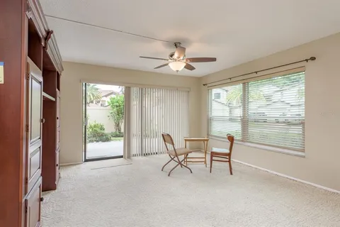 a view of a livingroom with furniture and a ceiling fan