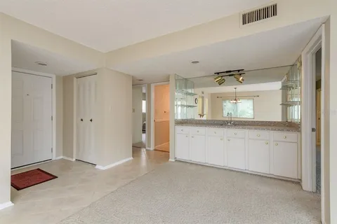a kitchen with stainless steel appliances granite countertop a sink stove and microwave