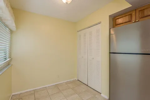 a living room with a couch and a chandelier