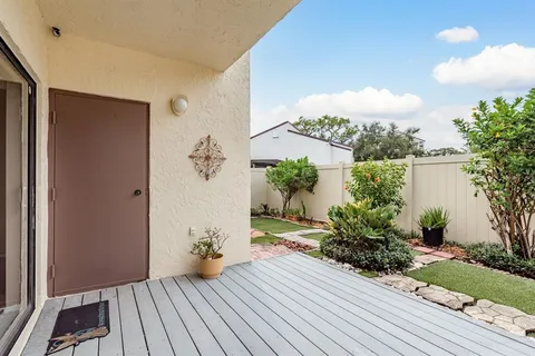 a bathroom with a granite countertop sink toilet and mirror