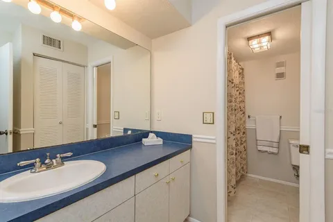 a bathroom with a shower and a toilet