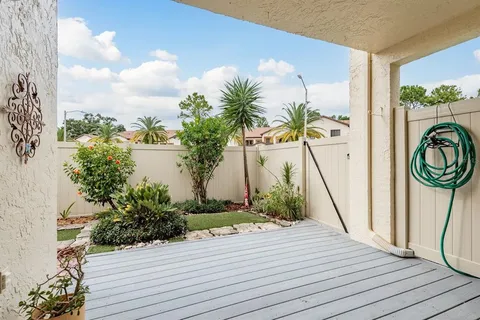 a view of outdoor space with wooden floor and entrance