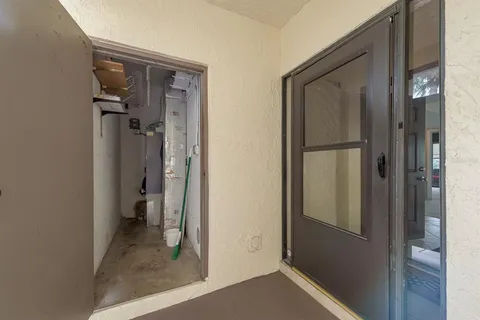 a bathroom with a sink mirror and vanity