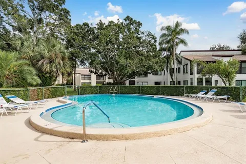 an aerial view of a house with swimming pool outdoor seating and entertaining space