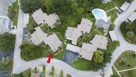 a view of a house with a garden and pathway