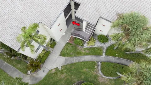 an aerial view of a house with a garden
