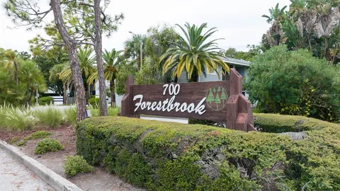 a kitchen with stainless steel appliances granite countertop a refrigerator a stove sink and cabinets