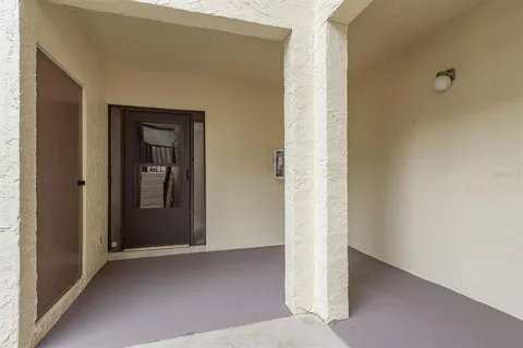 a view of a hallway with front door