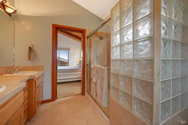 a view of a bathroom with a sink and mirror