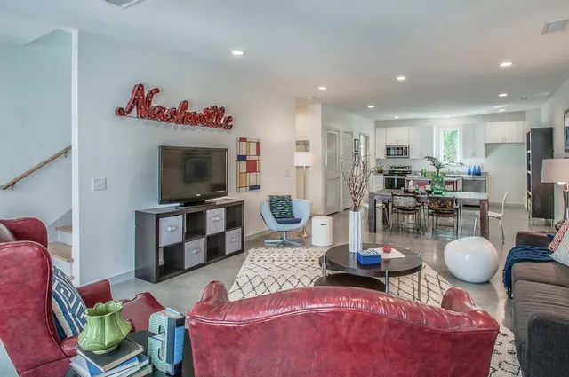 a living room with furniture and a flat screen tv